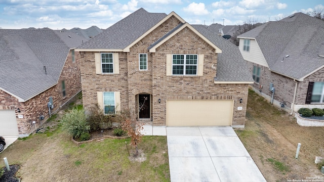 view of front facade with a garage and a front yard