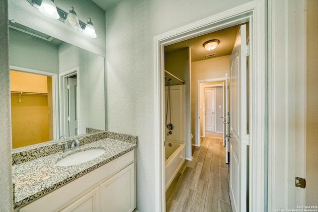 bathroom with vanity and  shower combination