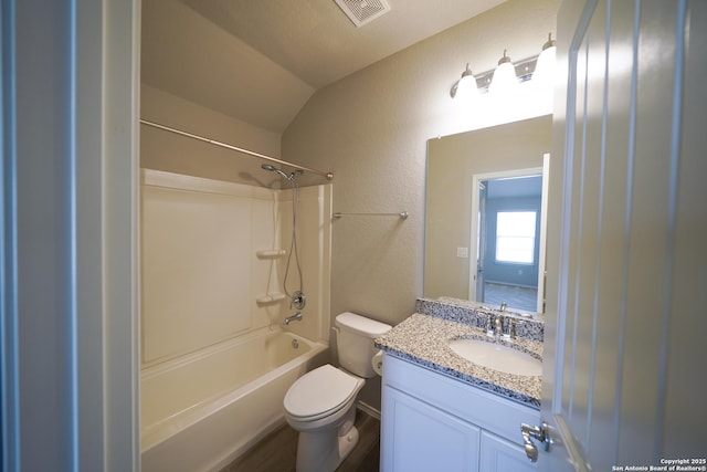 full bathroom with shower / bath combination, hardwood / wood-style floors, vanity, vaulted ceiling, and toilet