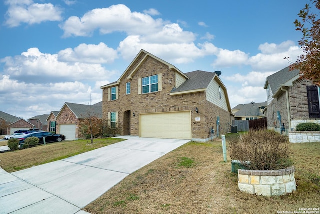 view of front of property with a garage, cooling unit, and a front lawn