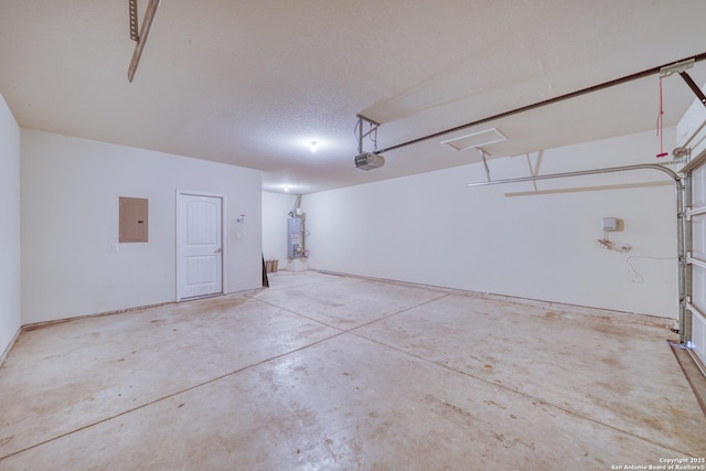 garage with a garage door opener, gas water heater, and electric panel