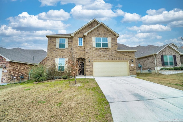 view of front of property featuring a garage and a front lawn