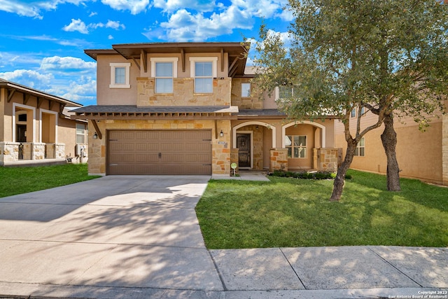 view of front of home with a garage and a front yard