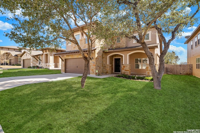 view of front of house featuring a garage and a front yard