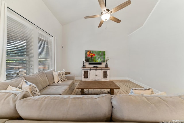 living room featuring ceiling fan and vaulted ceiling