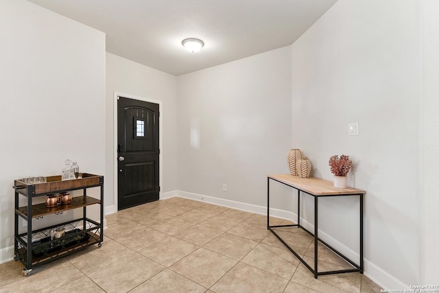 foyer entrance with light tile patterned floors