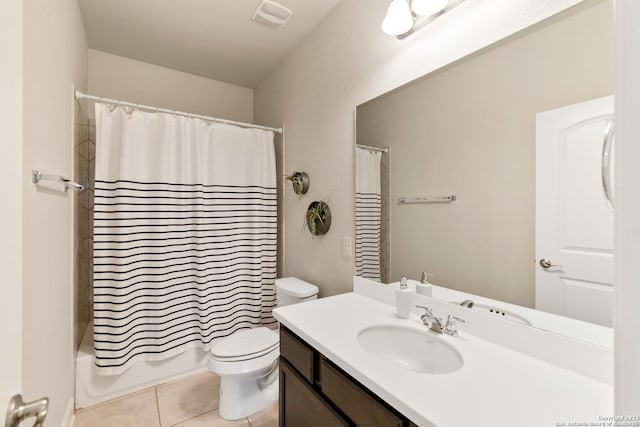 full bathroom with vanity, toilet, tile patterned flooring, and shower / bath combo