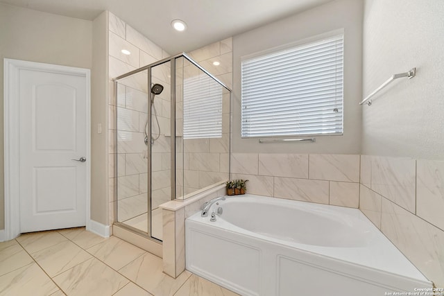 bathroom with shower with separate bathtub