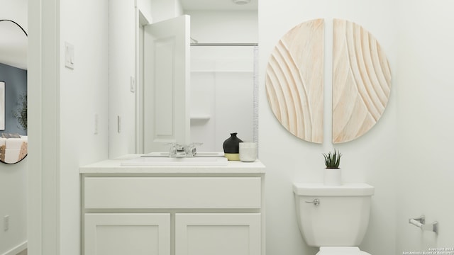 bathroom featuring vanity and toilet