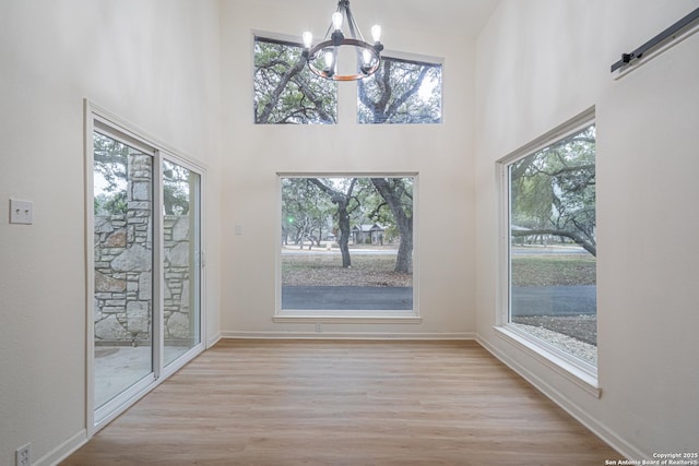 interior space with a healthy amount of sunlight and a chandelier