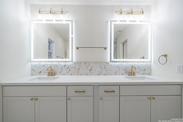 bathroom with vanity and decorative backsplash