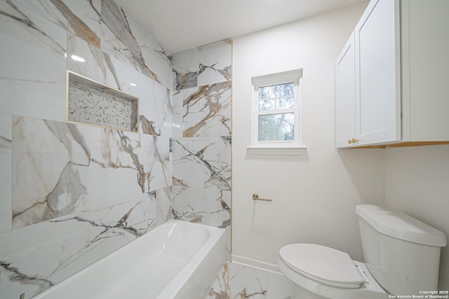 bathroom featuring shower / bathing tub combination and toilet