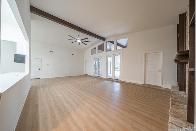 unfurnished living room with beamed ceiling, high vaulted ceiling, ceiling fan, and light hardwood / wood-style flooring