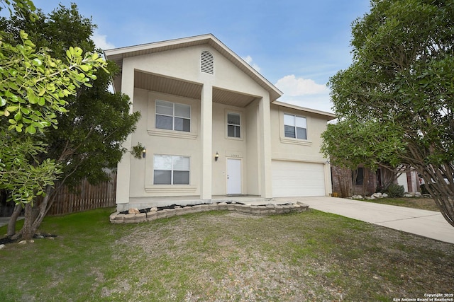 view of front facade featuring a garage and a front yard