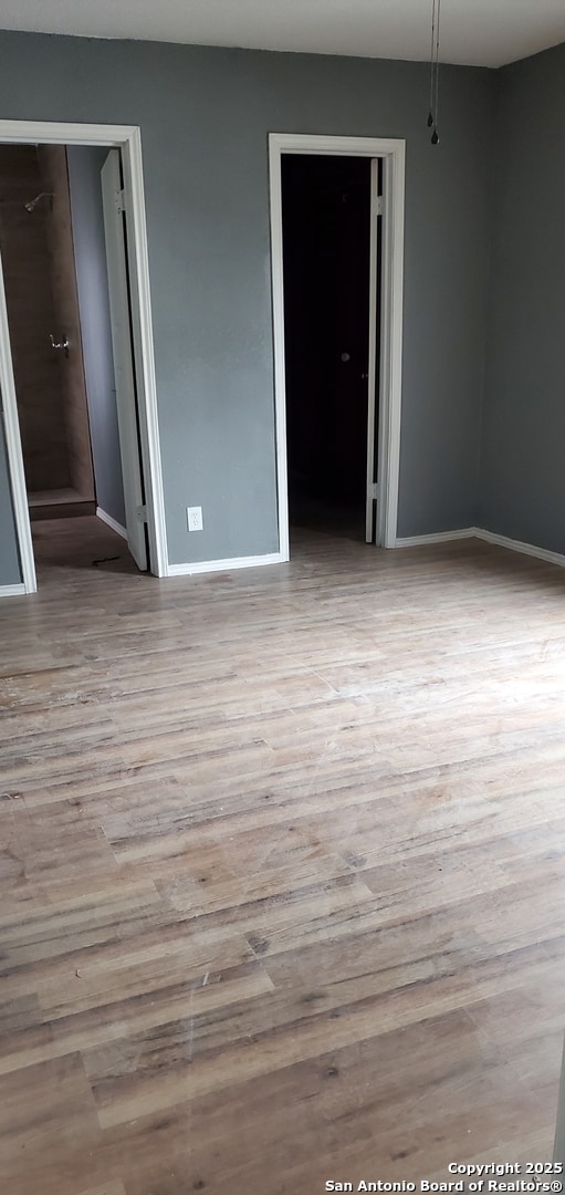 unfurnished room with light hardwood / wood-style flooring