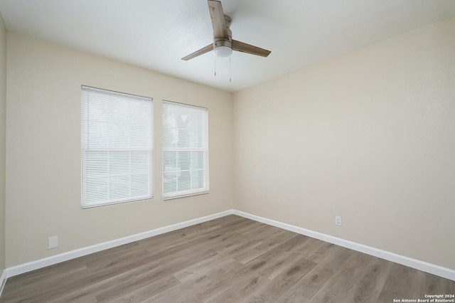 spare room with ceiling fan and light hardwood / wood-style flooring