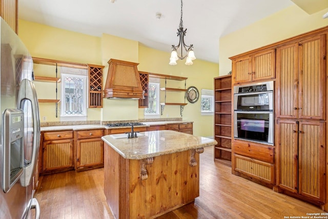 kitchen featuring open shelves, stainless steel appliances, light wood-style floors, premium range hood, and plenty of natural light