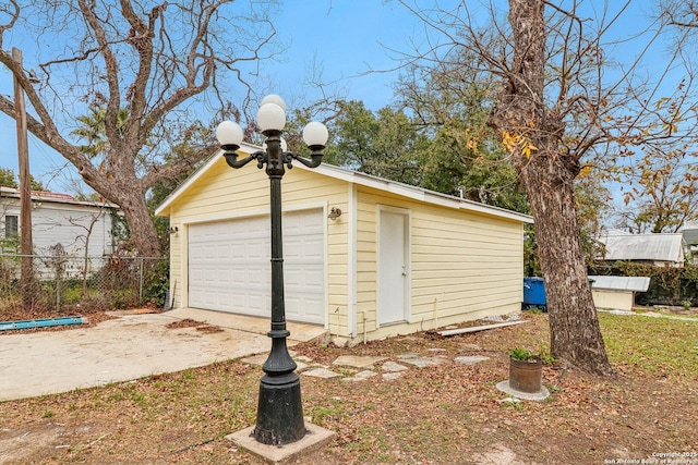 detached garage with fence