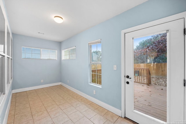 entryway with light tile patterned floors