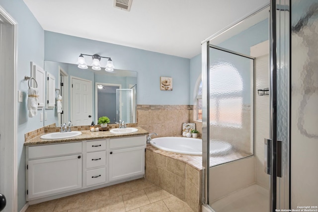 bathroom with vanity, tile patterned floors, and independent shower and bath