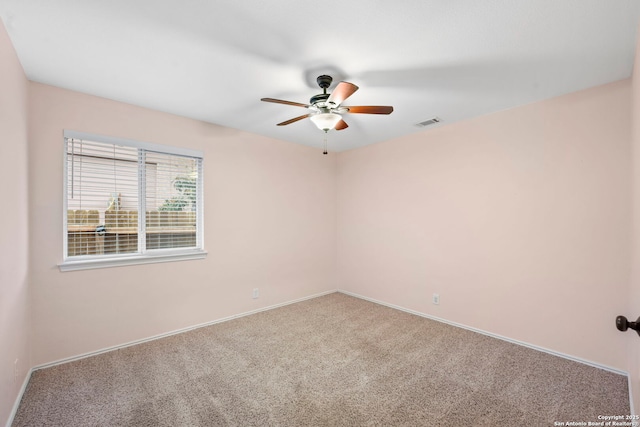 spare room with ceiling fan and carpet flooring