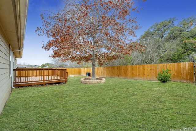 view of yard featuring a wooden deck