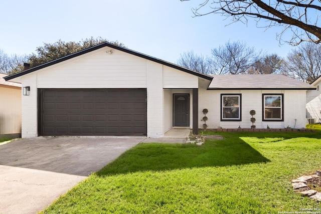 ranch-style house with a garage and a front yard