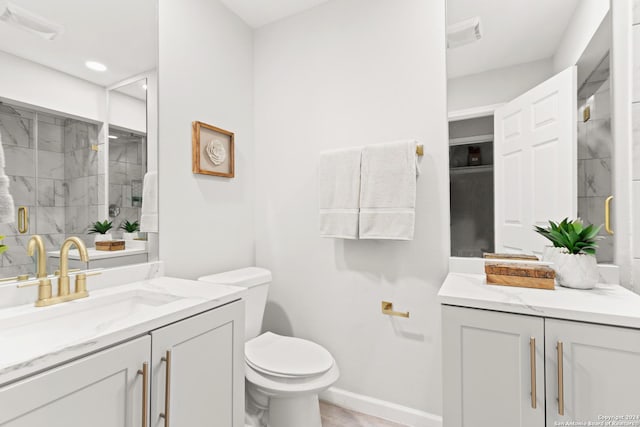 bathroom featuring vanity, toilet, and walk in shower