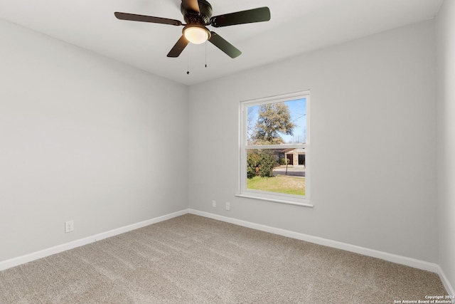 empty room featuring ceiling fan, a healthy amount of sunlight, and carpet floors