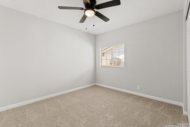 spare room featuring carpet flooring and ceiling fan