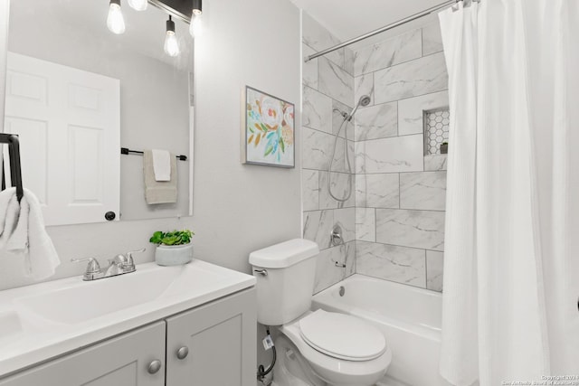 full bathroom featuring shower / tub combo, vanity, and toilet