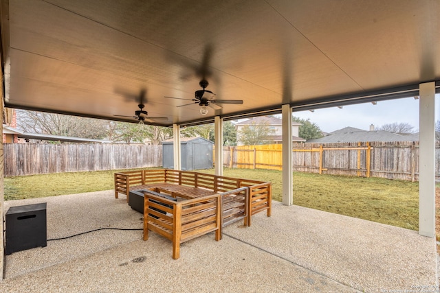 view of patio / terrace with ceiling fan and a storage unit