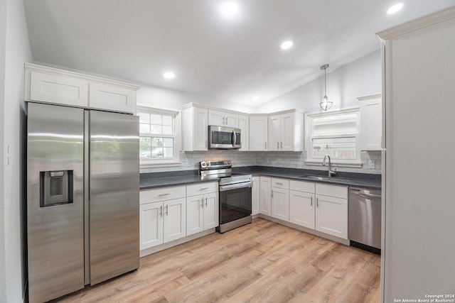 kitchen featuring sink, stainless steel appliances, and white cabinets