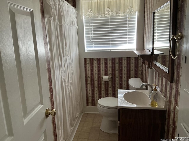 bathroom with tile patterned floors, toilet, and vanity