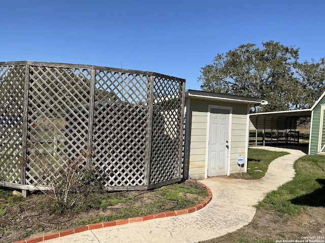 view of outbuilding with a carport