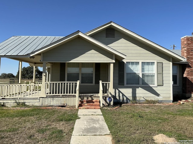 bungalow-style house featuring a front yard and a porch