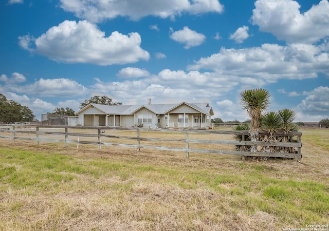 view of yard with a rural view