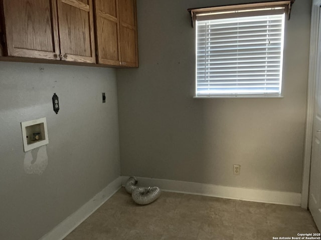 washroom with cabinets, hookup for a washing machine, hookup for an electric dryer, and a healthy amount of sunlight