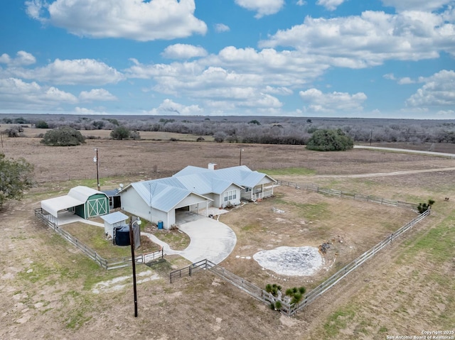 birds eye view of property featuring a rural view