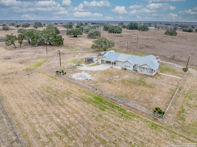 birds eye view of property featuring a rural view