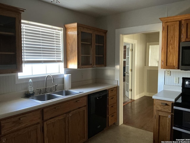 kitchen with sink and black appliances