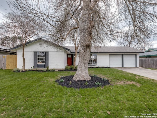 single story home featuring a garage and a front yard