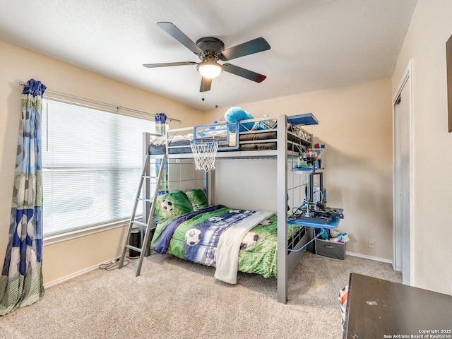 bedroom with ceiling fan and light colored carpet