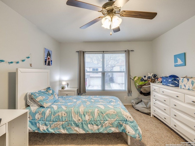 bedroom featuring light carpet and ceiling fan