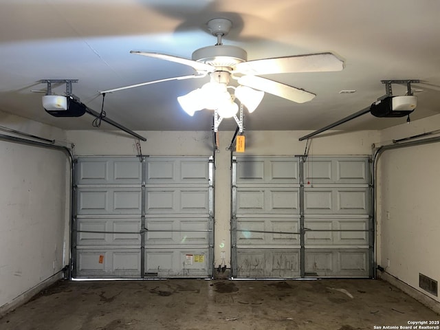 garage with a garage door opener and ceiling fan