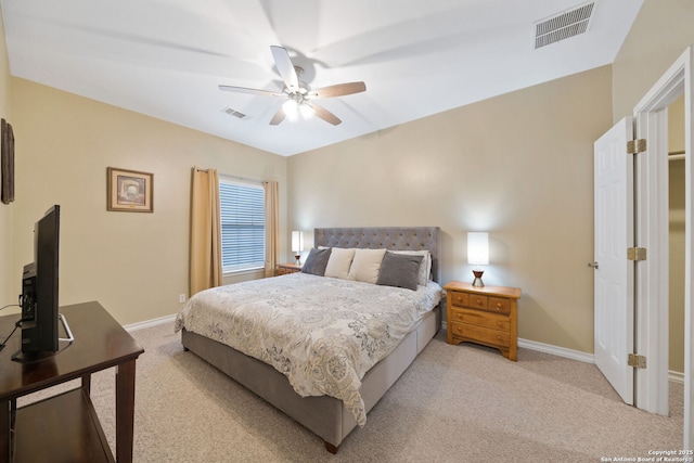 bedroom featuring light carpet and ceiling fan