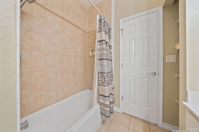 bathroom with tile patterned flooring and shower / tub combo