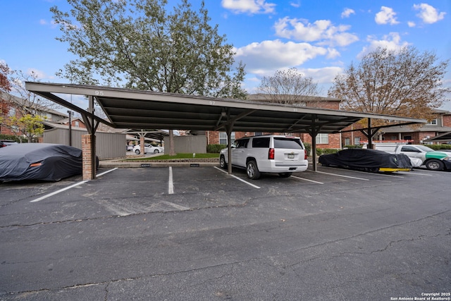 view of vehicle parking with a carport