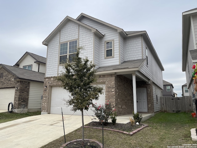 view of front facade with a garage and a front lawn