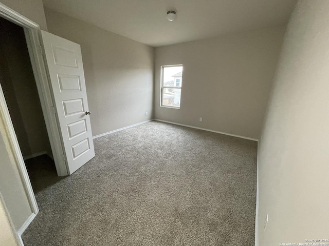 empty room featuring carpet floors